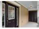 Covered entryway with dark brown door and additional storage at 1267 Marley Ln, Winter Springs, FL 32708