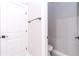 Small half bathroom with toilet and white door at 12707 Sw 78Th Pl, Dunnellon, FL 34432