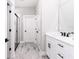 Modern bathroom with white vanity, quartz countertop and black accents at 12707 Sw 78Th Pl, Dunnellon, FL 34432