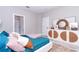 Spacious bedroom with teal bedding and built-in storage at 12707 Sw 78Th Pl, Dunnellon, FL 34432