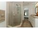 Tiled bathroom with a glass-enclosed shower, double sinks, and neutral decor at 1369 Black Willow Trl, Altamonte Springs, FL 32714