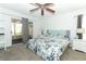 Cozy bedroom with a floral patterned bedspread and sliding door access to screened in porch at 1369 Black Willow Trl, Altamonte Springs, FL 32714