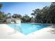 Expansive community pool with adjacent pool house set among lush trees for a relaxed setting at 1369 Black Willow Trl, Altamonte Springs, FL 32714