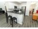 Modern kitchen featuring a breakfast bar and stainless steel appliances at 1369 Black Willow Trl, Altamonte Springs, FL 32714