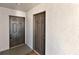 Condo entry with two doors and neutral colored walls at 13839 Fairway Island Dr # 1122, Orlando, FL 32837