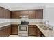 Modern kitchen with granite countertops and stainless steel appliances at 13839 Fairway Island Dr # 1122, Orlando, FL 32837