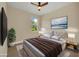 Virtually staged bedroom with a beige headboard and brown accents at 14 Fisher Loop Pass, Ocklawaha, FL 32179