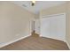 Bedroom with double door closet and wood-look flooring at 14 Fisher Loop Pass, Ocklawaha, FL 32179