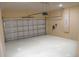 Garage with automatic opener and epoxy flooring at 14 Fisher Loop Pass, Ocklawaha, FL 32179