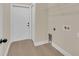 Laundry room with built-in shelving and vinyl flooring at 14 Fisher Loop Pass, Ocklawaha, FL 32179