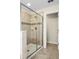 Bathroom with walk-in shower and access to a closet at 1498 Moon Valley Dr, Davenport, FL 33896