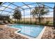 Private screened pool with brick pavers and plenty of space for relaxation at 1498 Moon Valley Dr, Davenport, FL 33896