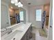 Bathroom boasts double vanity and tub at 16750 Toccoa Row, Winter Garden, FL 34787