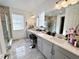 Large bathroom with double vanity and walk-in shower at 16750 Toccoa Row, Winter Garden, FL 34787