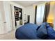 Bedroom with large closet and blue comforter at 16750 Toccoa Row, Winter Garden, FL 34787