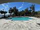 Inviting community pool with a spacious deck and lake views at 16750 Toccoa Row, Winter Garden, FL 34787