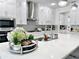 Kitchen island with white quartz countertop and stylish decor at 16750 Toccoa Row, Winter Garden, FL 34787