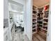 Well-organized pantry with ample shelving for storage at 16750 Toccoa Row, Winter Garden, FL 34787