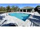 Community pool with plenty of lounge chairs for relaxation at 16750 Toccoa Row, Winter Garden, FL 34787