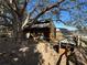 Wooden animal shelter with a large oak tree providing shade at 17901 Coralwood Ln, Groveland, FL 34736