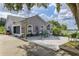 Paver patio with seating, perfect for outdoor entertaining and relaxation at 17901 Coralwood Ln, Groveland, FL 34736