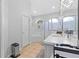 Bright bathroom features tub, tile floor, and vanity with white countertop at 17901 Coralwood Ln, Groveland, FL 34736