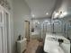 Bathroom features a garden tub, shower, and double vanity at 17901 Coralwood Ln, Groveland, FL 34736