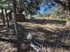 Large wooden chicken coop with a metal roof near a playground at 17901 Coralwood Ln, Groveland, FL 34736