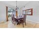 Dining room with tile floors and a large window at 17901 Coralwood Ln, Groveland, FL 34736