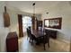 Elegant dining room with large wood table and six chairs at 17901 Coralwood Ln, Groveland, FL 34736