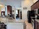 Modern kitchen with granite countertops and dark wood cabinets at 17901 Coralwood Ln, Groveland, FL 34736