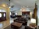 Spacious living room with open floor plan to kitchen and dining areas at 17901 Coralwood Ln, Groveland, FL 34736