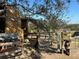Wooden stable with a pony in the foreground, next to a wire fence at 17901 Coralwood Ln, Groveland, FL 34736