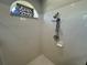 Clean shower with tiled walls and modern fixtures at 17901 Coralwood Ln, Groveland, FL 34736