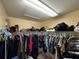 Large walk-in closet with ample shelving and hanging space at 17901 Coralwood Ln, Groveland, FL 34736