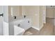 Modern bathroom with double vanity and white cabinets at 18 Malauka Pass Ter, Ocklawaha, FL 32179