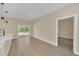 Open concept kitchen and dining area with sliding glass door to backyard at 18 Malauka Pass Ter, Ocklawaha, FL 32179