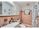 Retro bathroom with pink tile and a shower/tub combo at 1817 W Grant St, Orlando, FL 32805