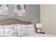 King bed, neutral decor, and elegant wall art in a well-lit bedroom at 2182 Fleming Mist Pl, Kissimmee, FL 34747