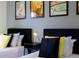 Twin bedroom with yellow and black accents at 2182 Fleming Mist Pl, Kissimmee, FL 34747