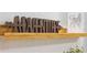 Wooden shelf with inspirational decor at 2182 Fleming Mist Pl, Kissimmee, FL 34747