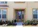 Modern front door with glass panels and sidelights at 2182 Fleming Mist Pl, Kissimmee, FL 34747