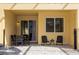 Patio with table and chairs, adjacent to house at 2182 Fleming Mist Pl, Kissimmee, FL 34747