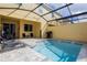 Private screened pool area with patio furniture and grill at 2182 Fleming Mist Pl, Kissimmee, FL 34747