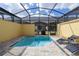 Private screened pool with lounge chairs at 2182 Fleming Mist Pl, Kissimmee, FL 34747