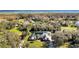 Scenic aerial view of property showcasing verdant lawns and mature trees at 2305 Leeward Cv, Kissimmee, FL 34746