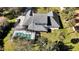 Aerial view of a house with a pool and a large yard at 2305 Leeward Cv, Kissimmee, FL 34746