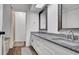 Modern bathroom featuring a double sink vanity with granite countertop at 2305 Leeward Cv, Kissimmee, FL 34746