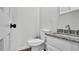 Half bathroom featuring granite countertop and decorative fixtures at 2305 Leeward Cv, Kissimmee, FL 34746
