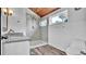 Bathroom features a glass enclosed shower, wood look tile, and wood ceiling at 2305 Leeward Cv, Kissimmee, FL 34746